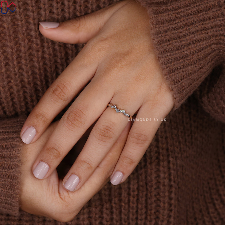 Stackable wedding band designed in yellow gold for flexible layering options.
