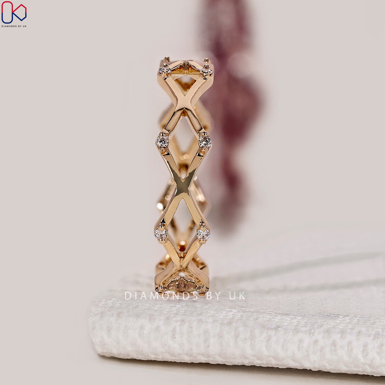 Lab grown round diamond band with crossover style.
