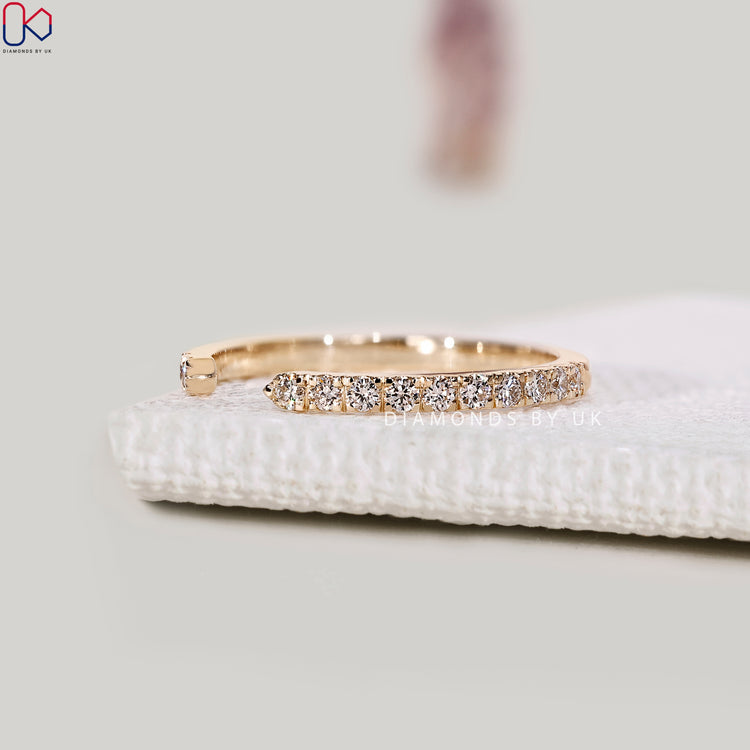 Open cuff band design with diamonds, perfect for a special occasion.