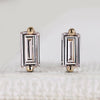 Baguette cut diamond earrings in a stud style.