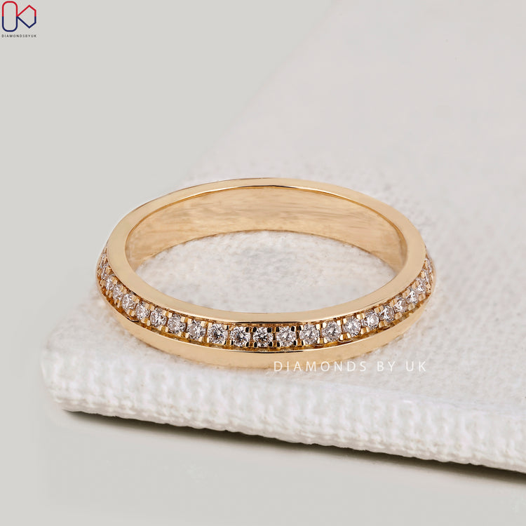 Handmade round diamond band with knife edge style.
