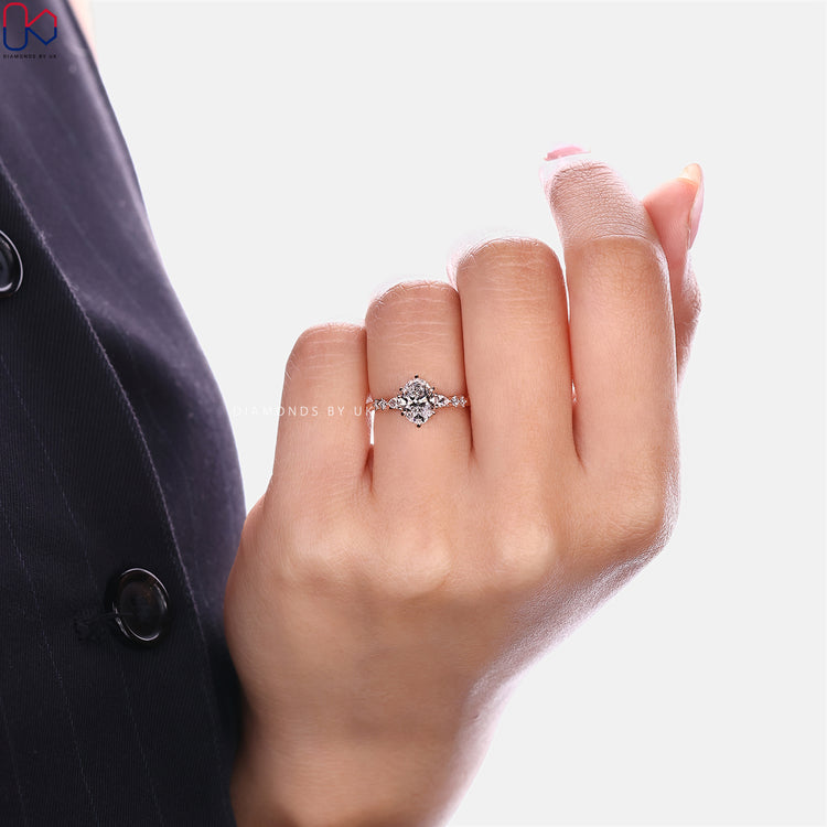 IGI certified oval diamond ring with six claw prongs.
