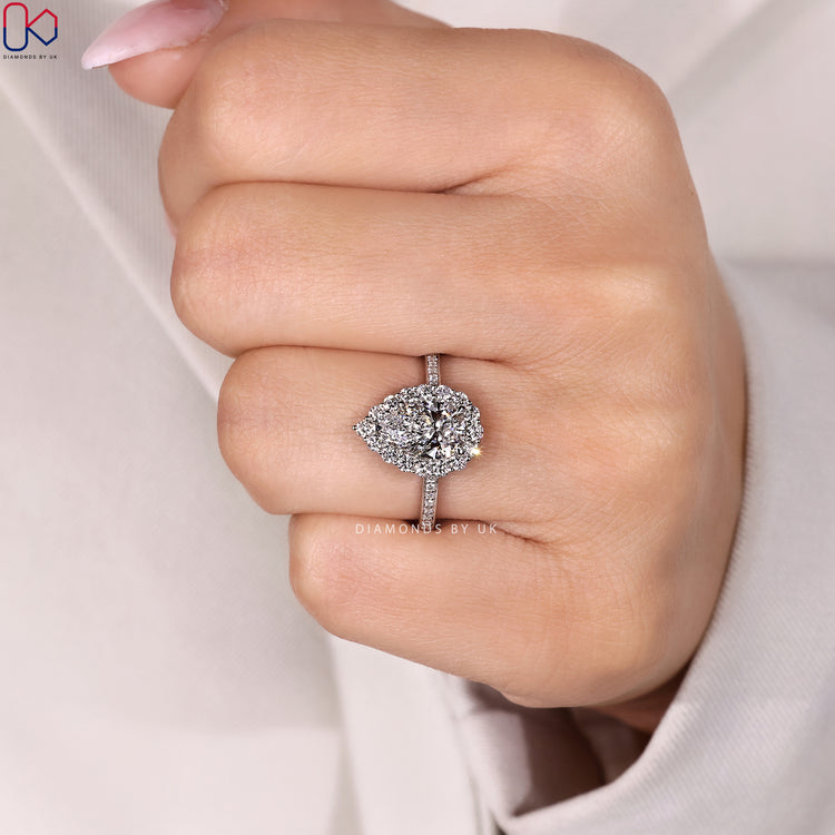 Three claw pear diamond ring with pavé style.