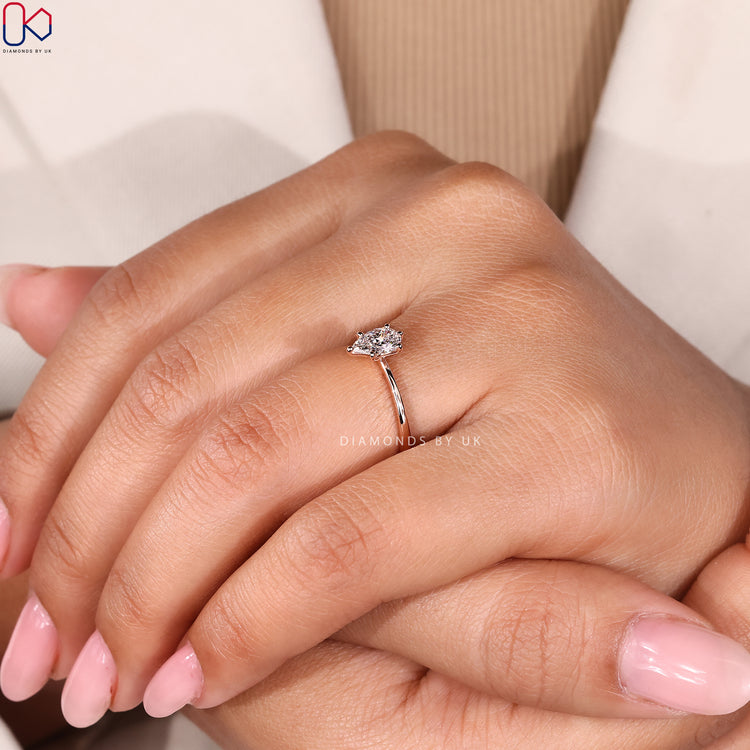 Pear cut solitaire ring with six prong setting.