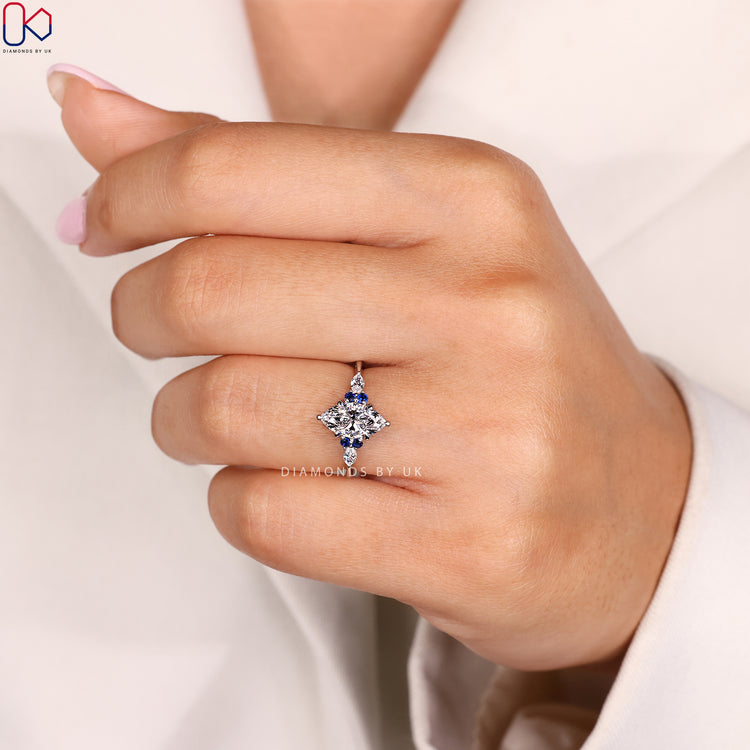 Blue sapphire marquise ring with side stones.