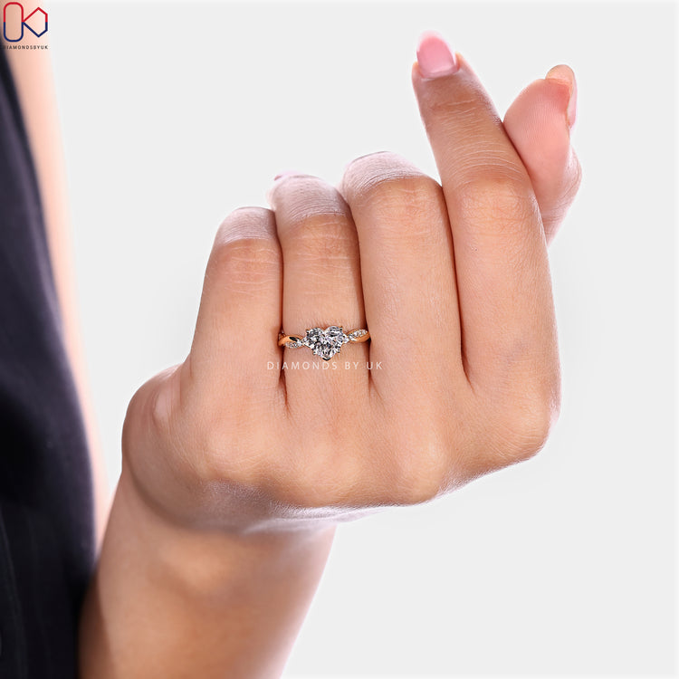 Heart cut lab grown diamond ring with round pavé.
