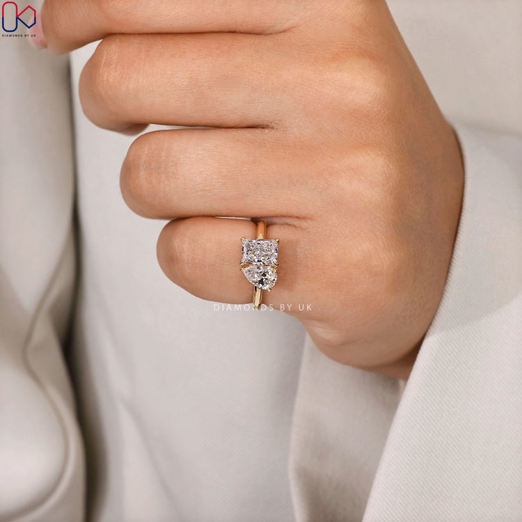 Pear and radiant cut lab grown diamond ring.