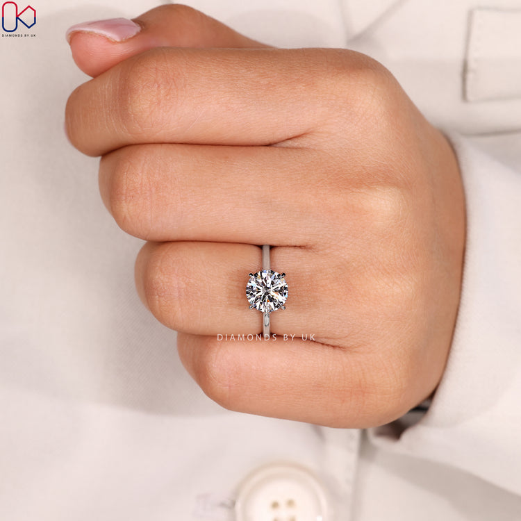 Round diamond ring with secure prong setting.