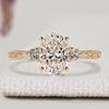 Oval cut diamond ring with round side stones
