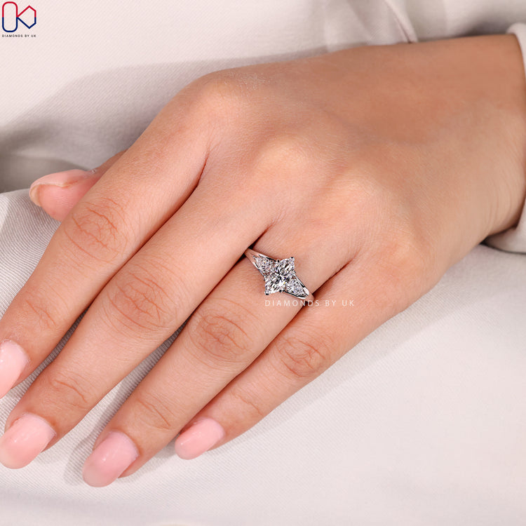 Marquise diamond ring with pear side stones.