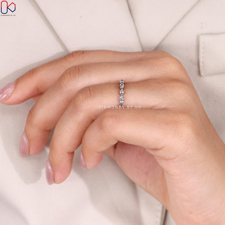 Marquise and round cut band with half eternity style.