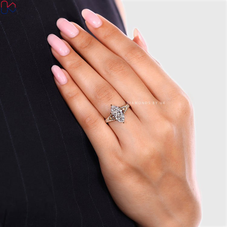 Lab grown marquise solitaire ring with six claw prongs.
