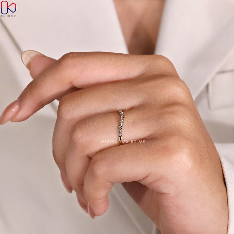 Round diamond curved wedding band with half eternity.