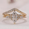 Marquise diamond engagement ring with V shaped wedding band.