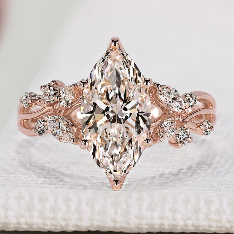 Nature inspired engagement ring with marquise diamond.
