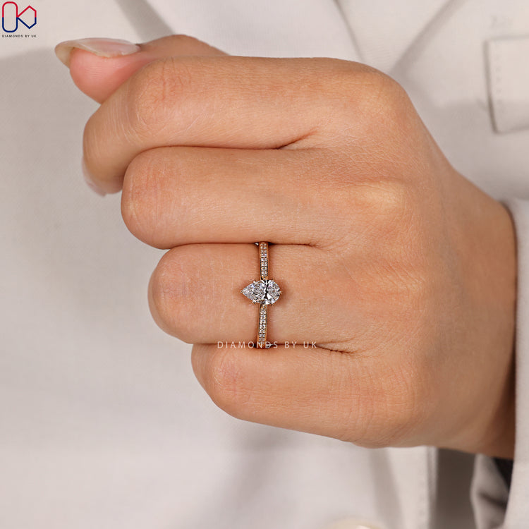 Tapered pavé pear cut lab grown diamond ring.