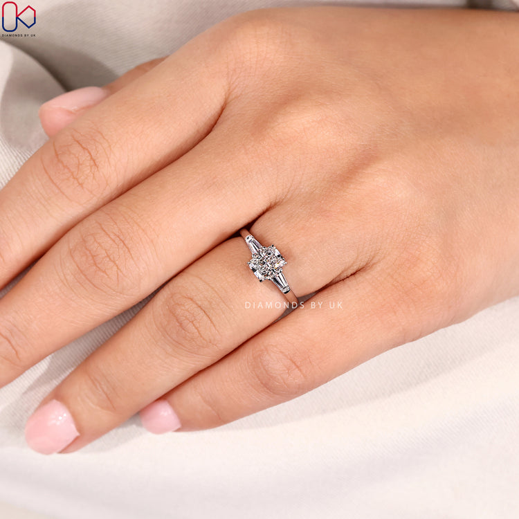 Handmade pear ring with round side stone design.