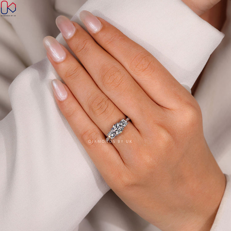 Round cut ring with four prong cathedral setting.
