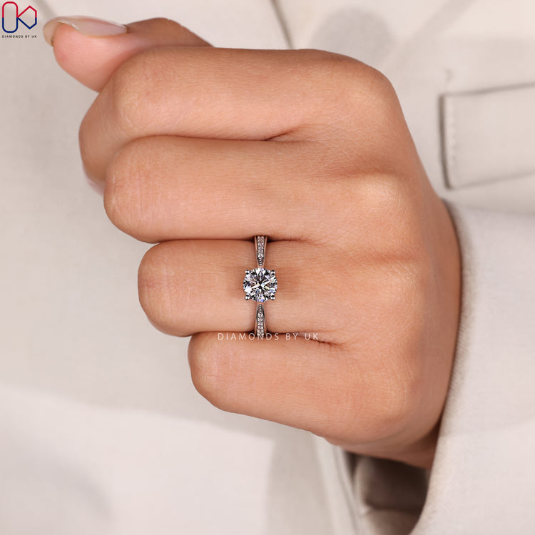 Cathedral round diamond ring with four prong setting