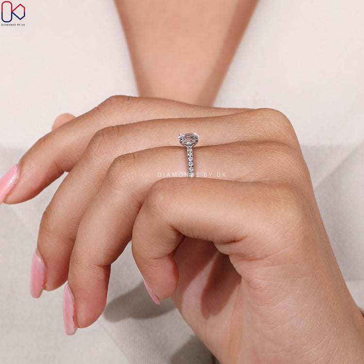 Lab grown oval cut ring with four claw prongs.