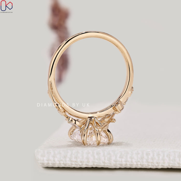 IGI certified radiant diamond ring with round side stones.