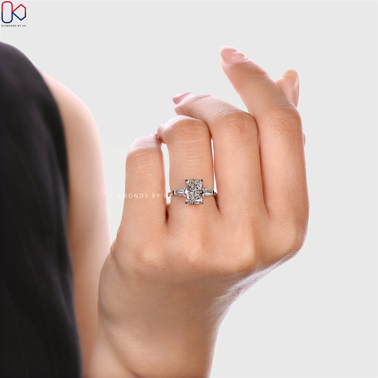 Cushion cut lab grown diamond ring with side stones.
