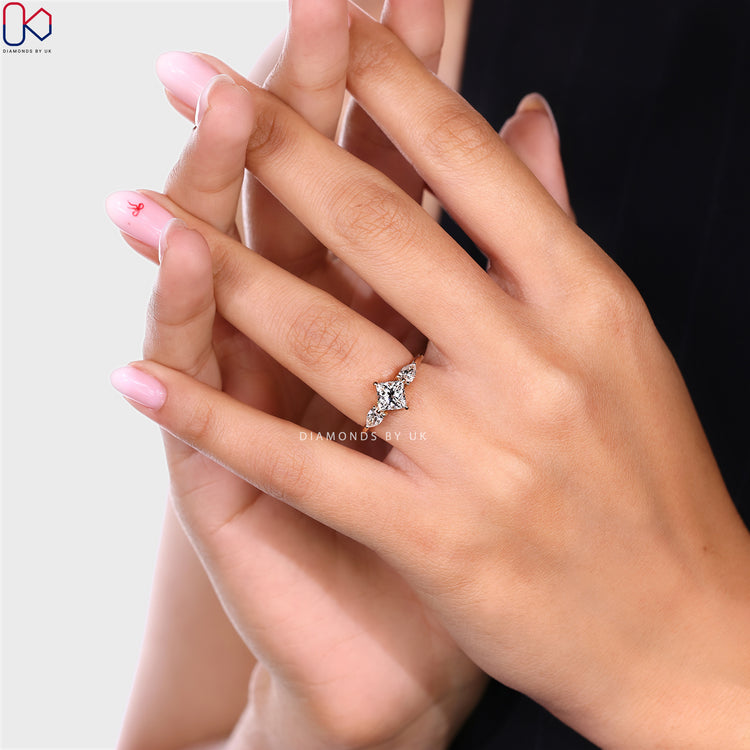 Diamondsbyuk handmade princess ring with pear side stone.

