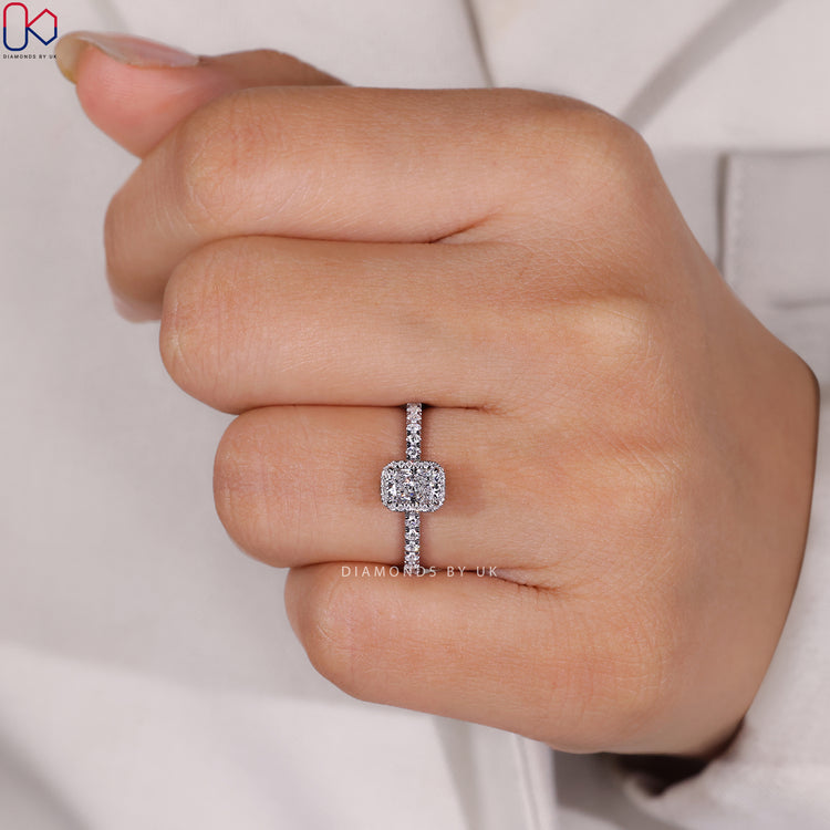Radiant cut ring with four claw prong setting.