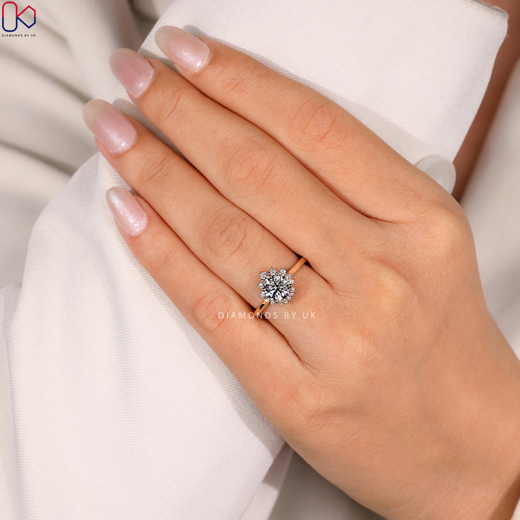 Round diamond ring with cathedral and prong setting.
