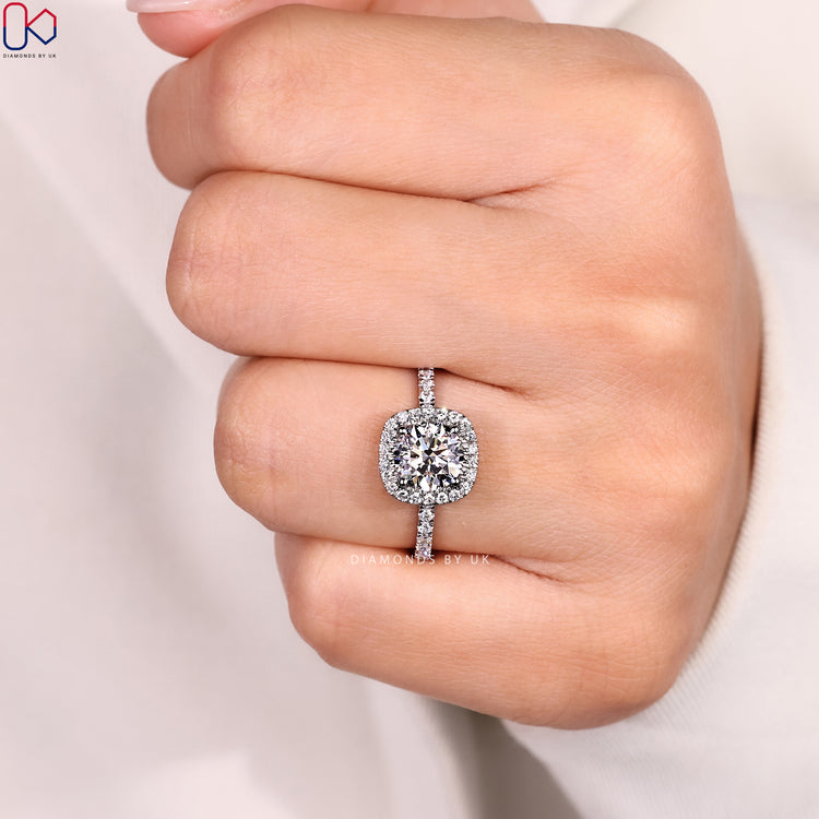 Four claw round diamond ring with halo style.
