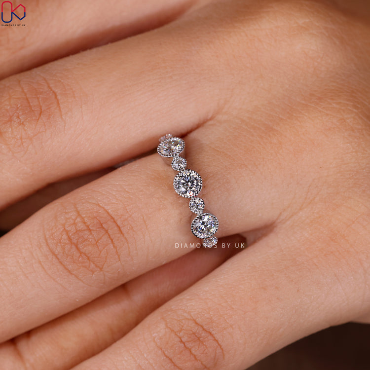 Round lab grown diamond wedding band with milgrain details.
