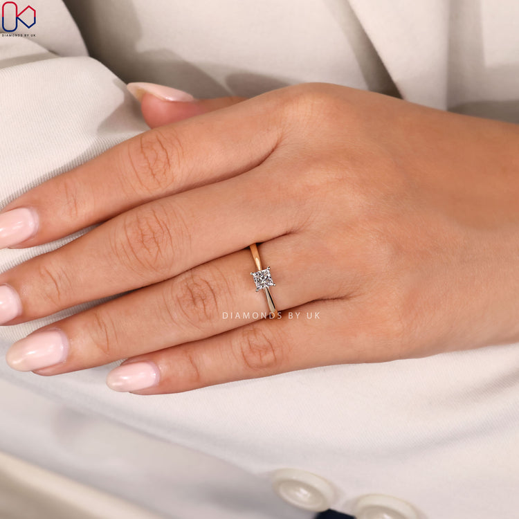 Princess cut ring with secure four prong setting.