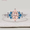 Marquise engagement ring with pink centre diamond and aquamarine
