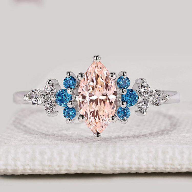 Marquise engagement ring with pink centre diamond and aquamarine

