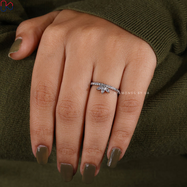 Marquise diamond band with round stones and prong setting.
