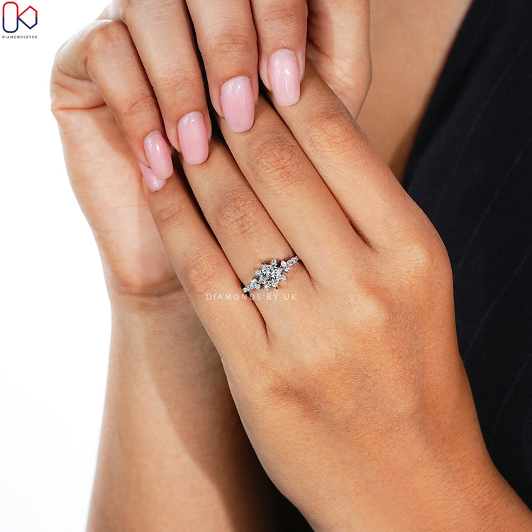 Diamondsbyuk princess diamond ring with side stones.
