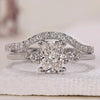 Radiant cut engagement ring with round side stones and wedding band.