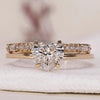 Heart cut diamond ring with hidden halo and wedding band.