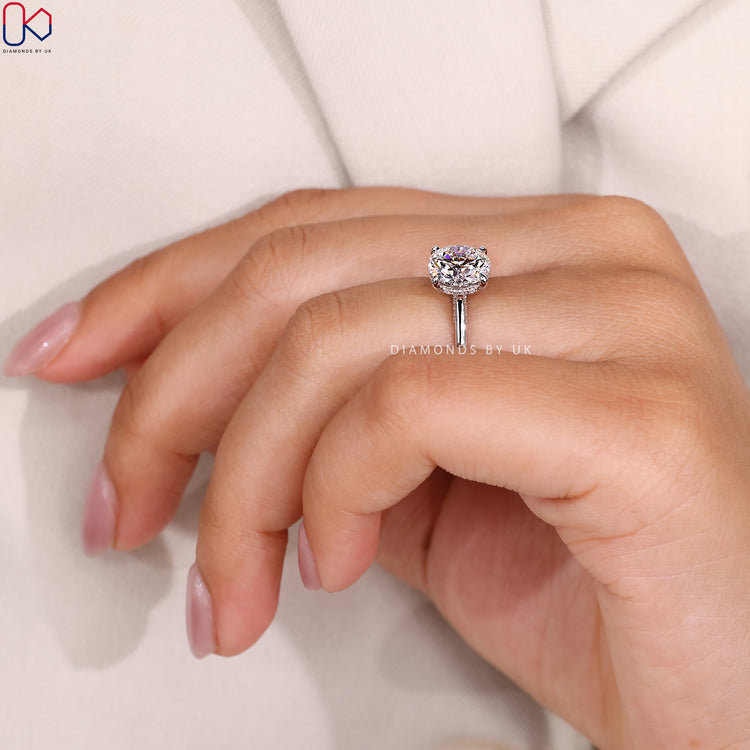 Cathedral round ring with hidden halo design.