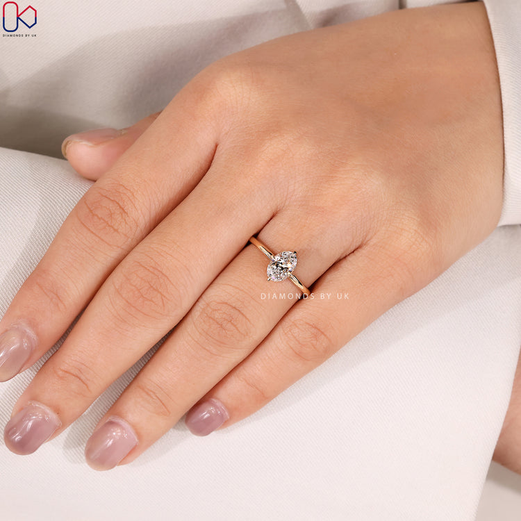 Oval cut engagement ring with compass prong design.