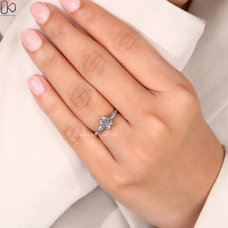 Lab grown pear diamond ring with claw prongs.