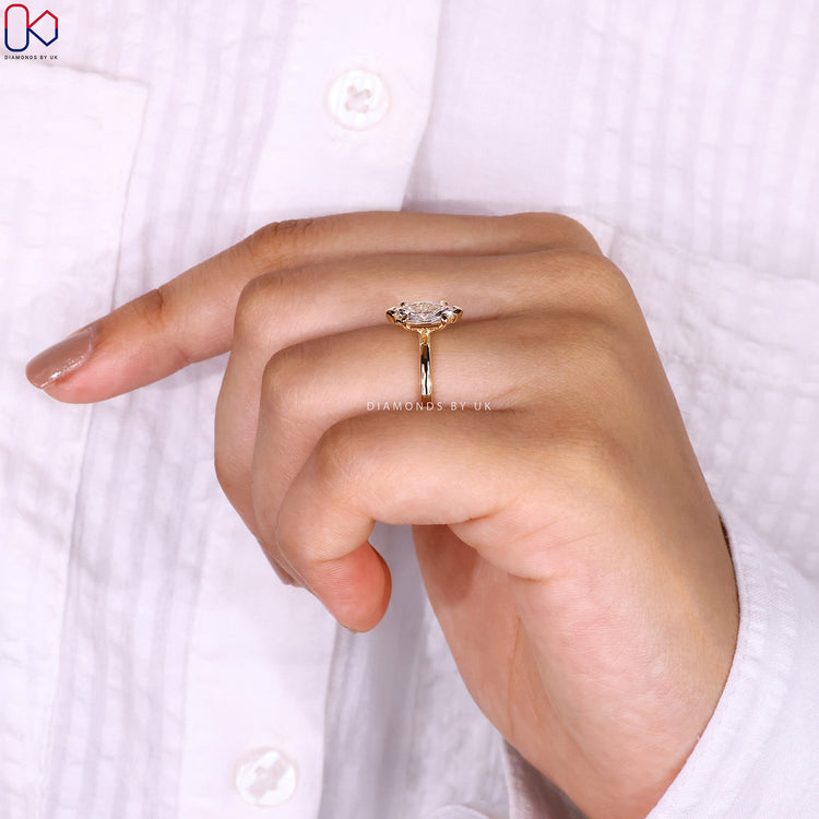 Marquise cut diamond ring with secure V prongs.