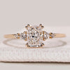 Radiant cut ring with round side stone design.