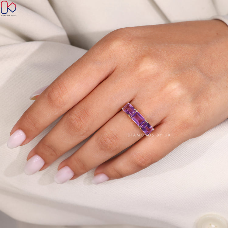 Three stone engagement ring with prong set gems