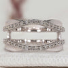 Enhancer wedding band with round diamonds and wrap guard.