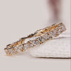 Marquise diamond full eternity wedding band crafted in yellow gold for lasting wear.
