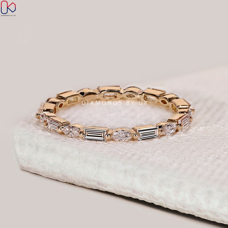 Marquise and baguette band crafted from premium yellow gold.
