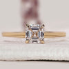 Asscher cut diamond solitaire ring in yellow gold.