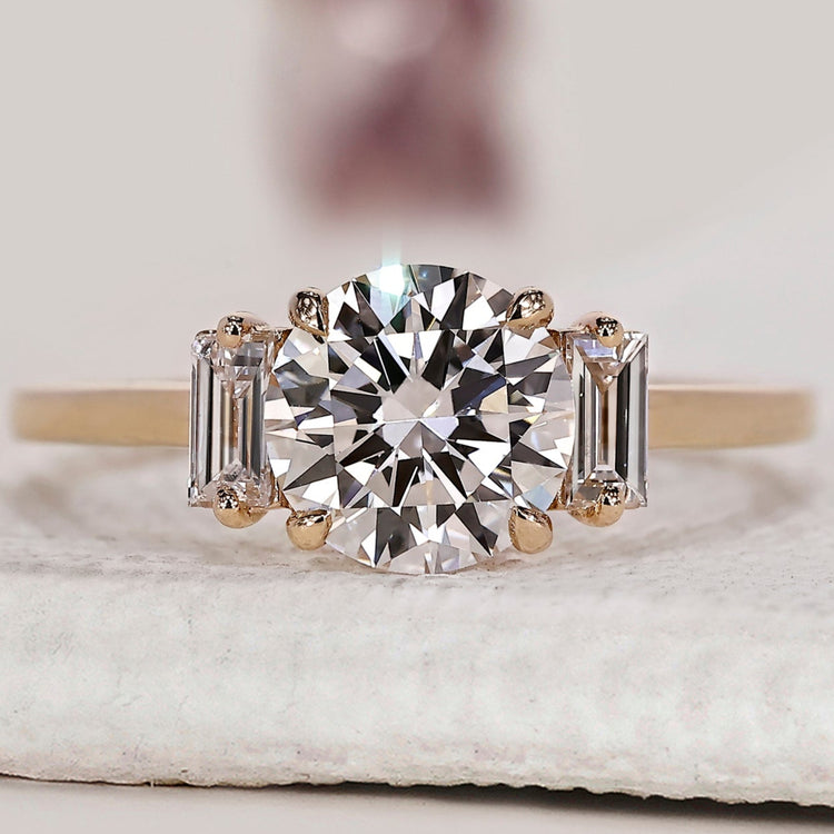 3 stone diamond engagement ring with round diamond engagement ring.
