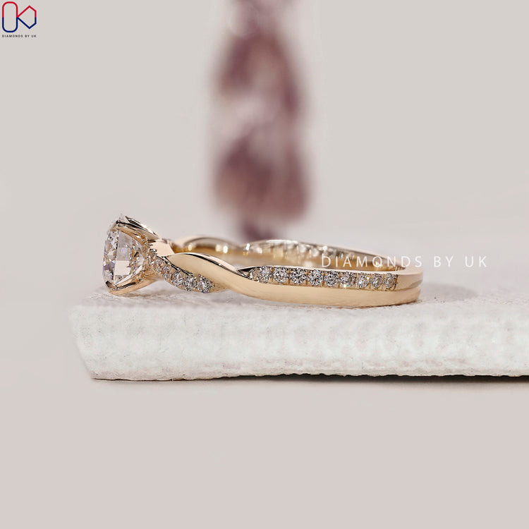 Handmade jewellery with round diamond engagement ring.
